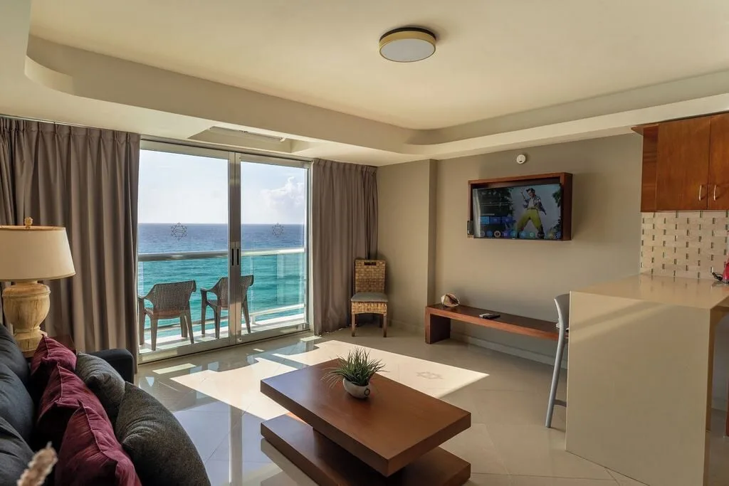 Penthouse living room with balcony and ocean view at Ocean Dream Cancun.