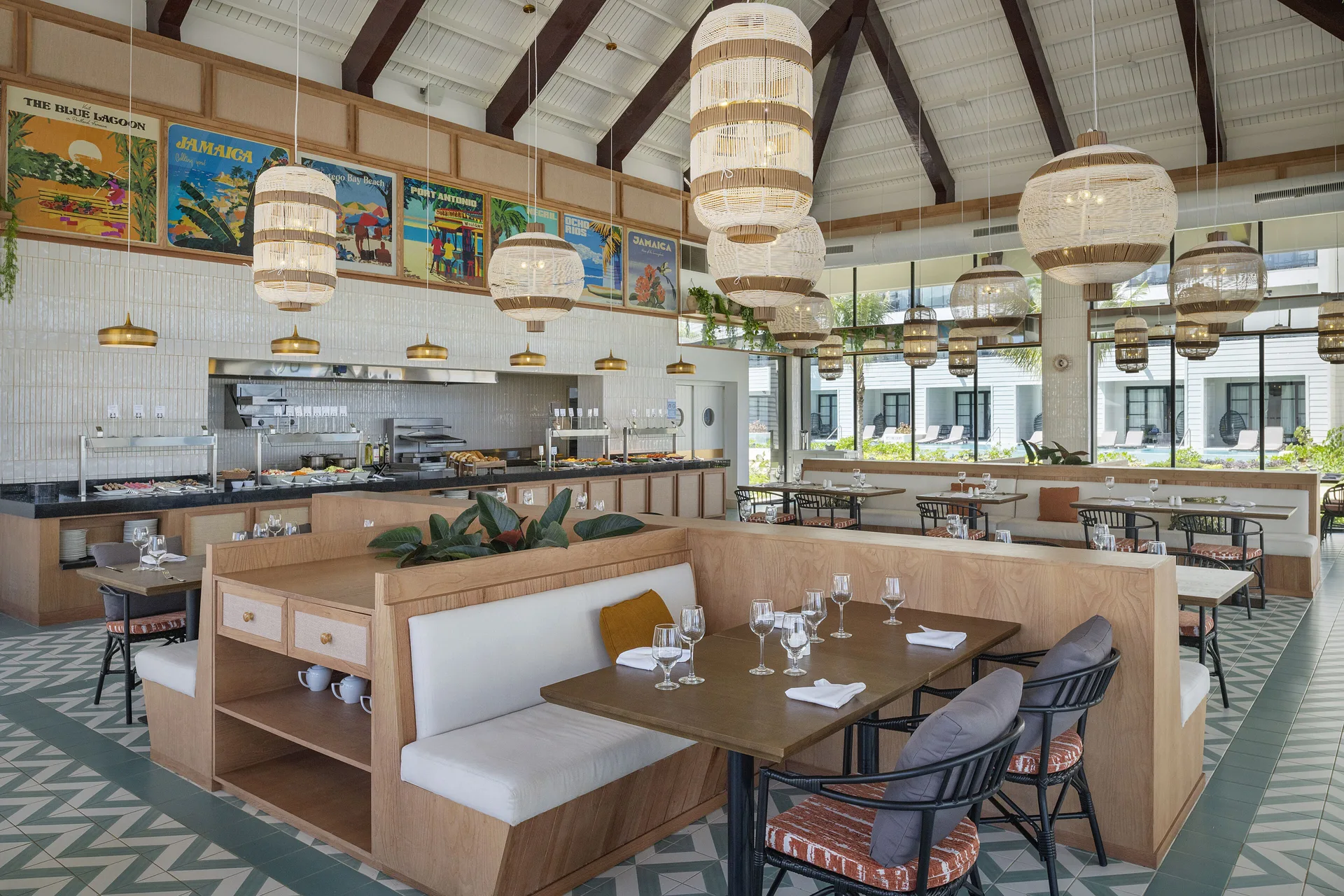 Buffet-style dining room with high ceiling and woven lamps at Ocean Eden Bay.