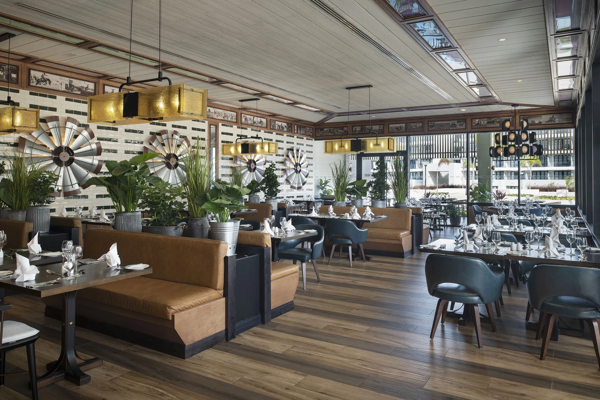Restaurant interior with booth seating and windmill wall decor at Ocean Eden Bay.