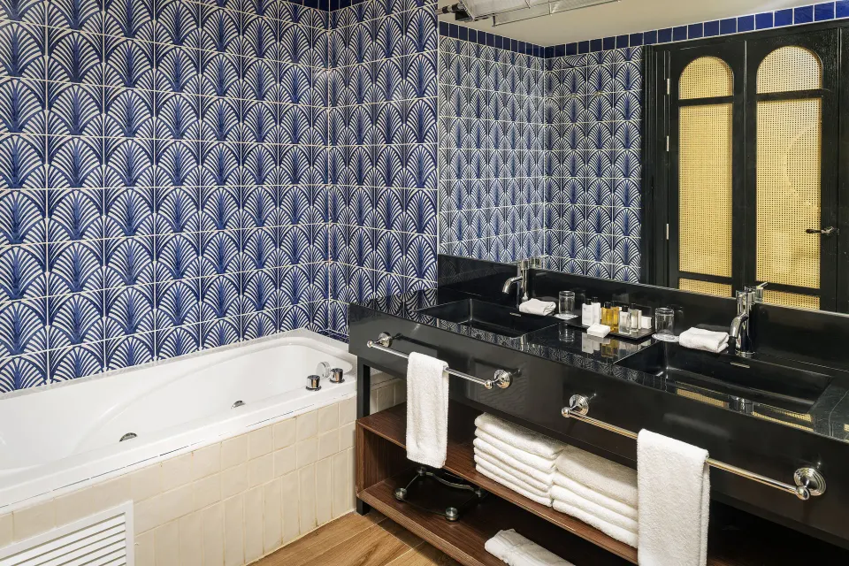 Junior Suite Nature View bathroom with bathtub and double vanity at Ocean Eden Bay.