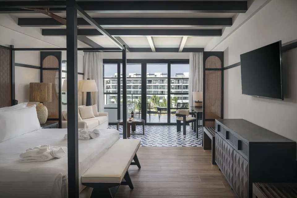 Privilege Junior Suite Ocean Eden Bay with king bed and balcony at Ocean Eden Bay.