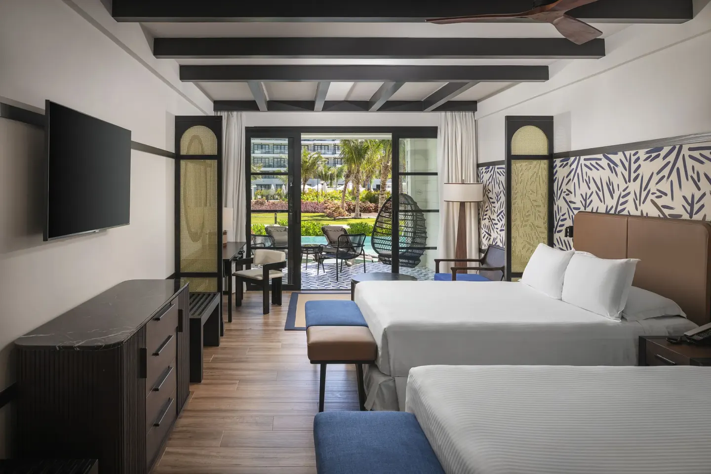 Privilege Junior Suite Swim Up with two beds and patio at Ocean Eden Bay.