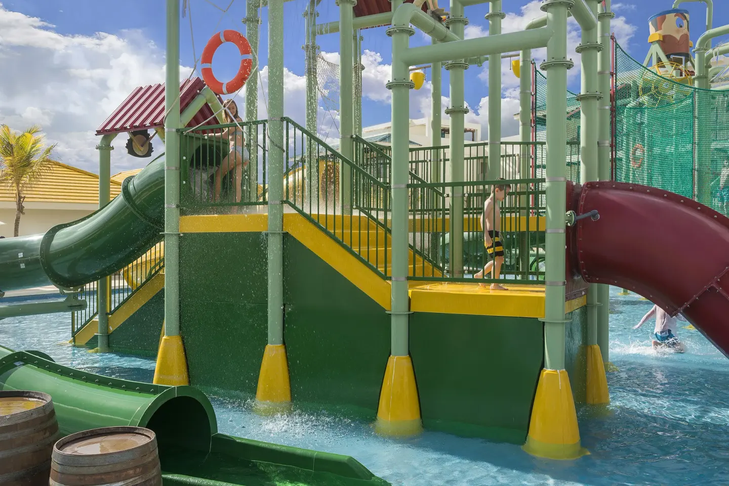 Children’s splash area with slides and water features at Ocean El Faro Resort.