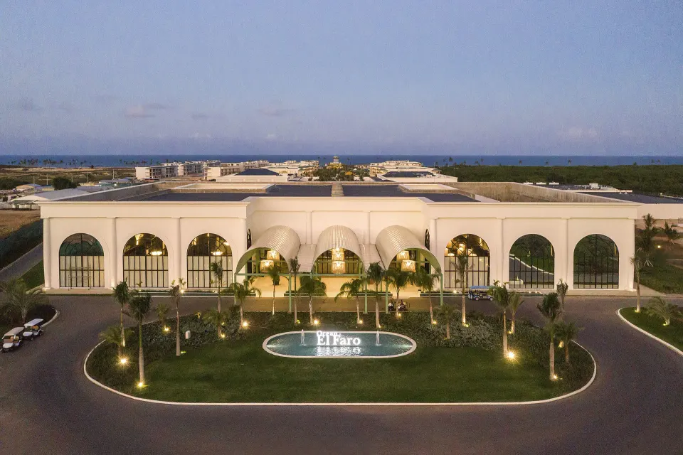 Aerial view of the illuminated entrance building at Ocean El Faro Resort.