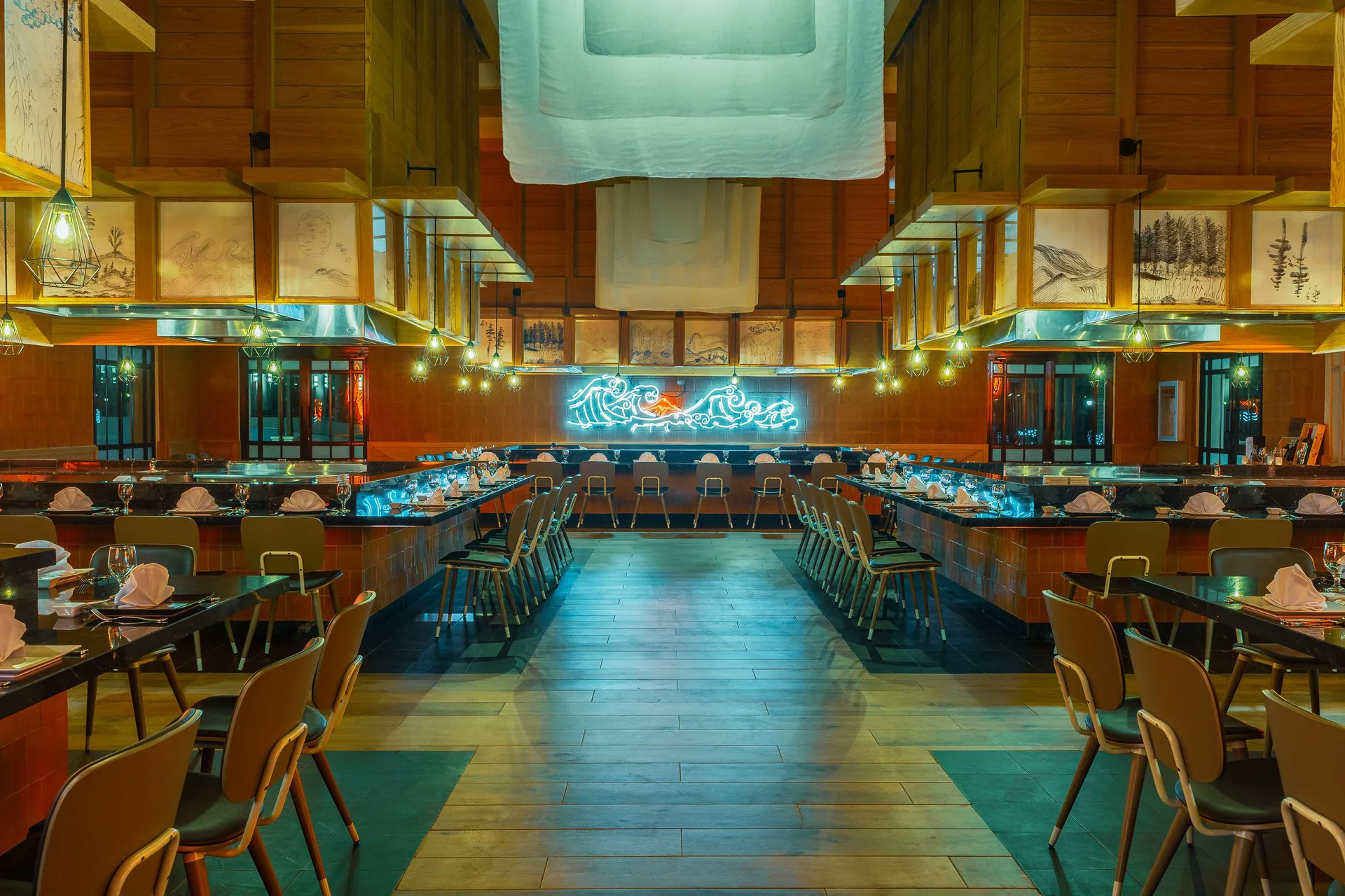 Grill-style restaurant with counter seating and warm wood decor at Ocean El Faro Resort.
