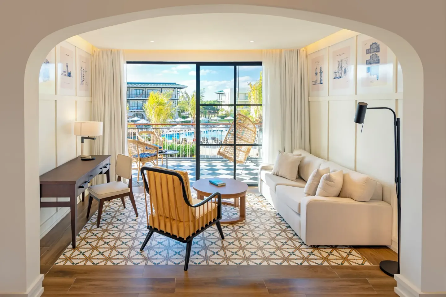 Junior Suite Corner Waterpark Side living area with balcony at Ocean El Faro Resort.