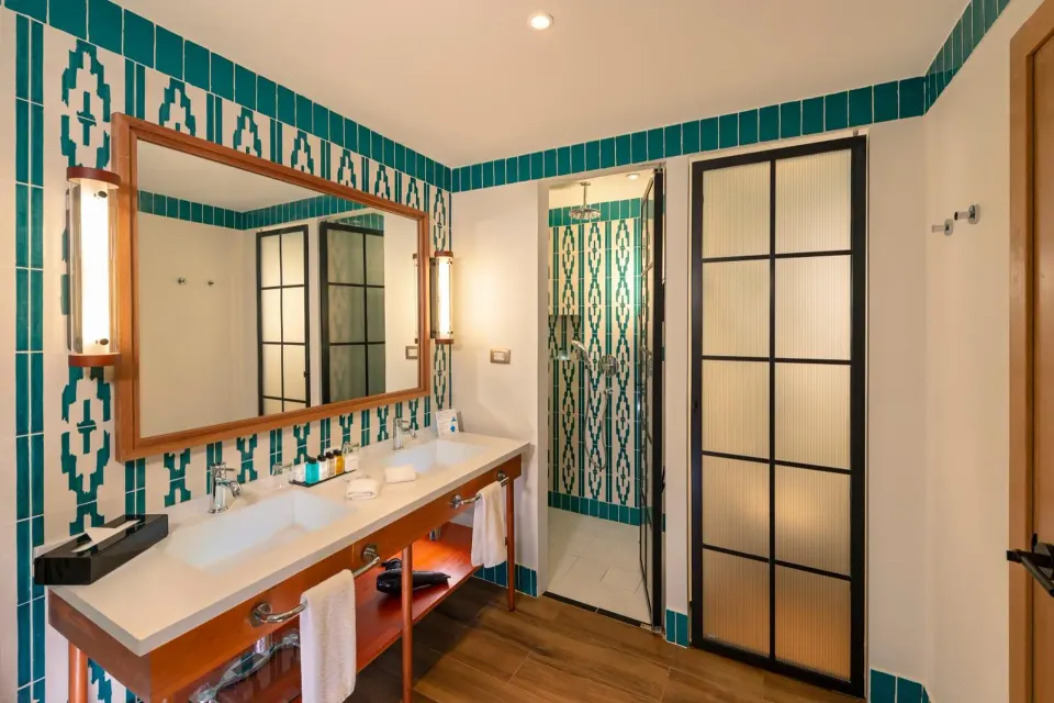 Junior Suite Nature View bathroom vanity and shower at Ocean El Faro Resort.
