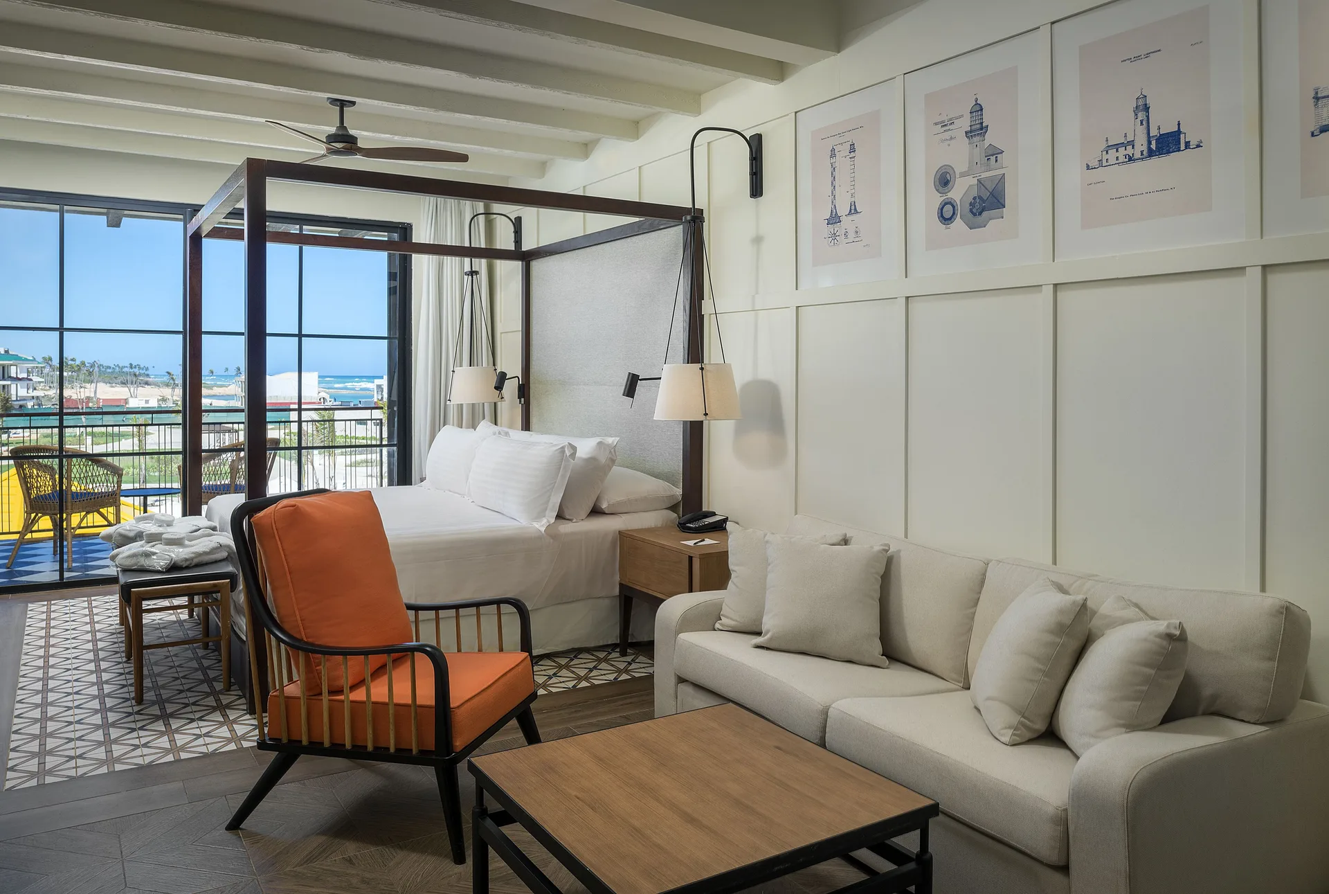 Junior Suite Ocean El Faro Resort with canopy bed and balcony at Ocean El Faro Resort.