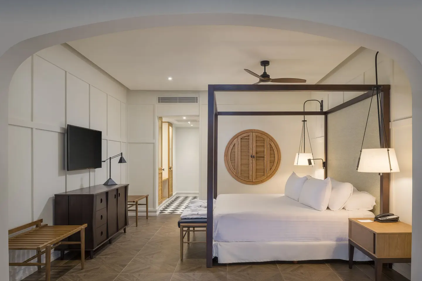 Privilege Master Suite Swim Up king bed and TV area at Ocean El Faro Resort.
