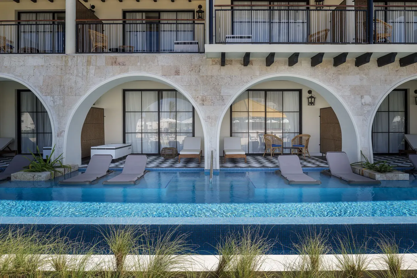 Privilege Master Suite Swim Up patios and shared pool at Ocean El Faro Resort.