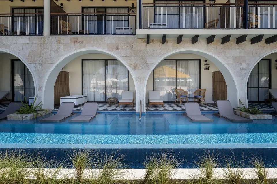 Privilege Master Suite Swim Up patios and shared pool at Ocean El Faro Resort.