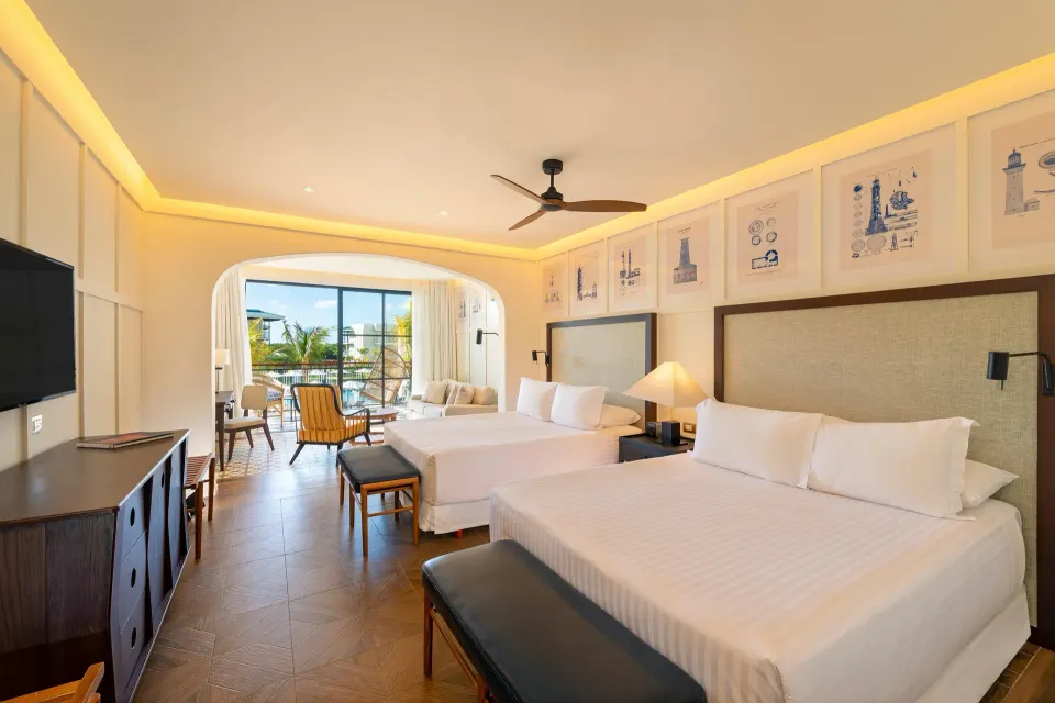 Junior pool view room with two beds and balcony at Ocean El Faro Resort.