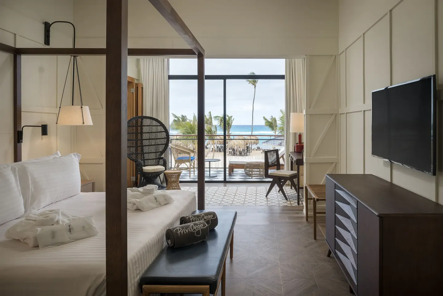 Royal Master Suite king bed facing balcony and ocean at Ocean El Faro Resort.