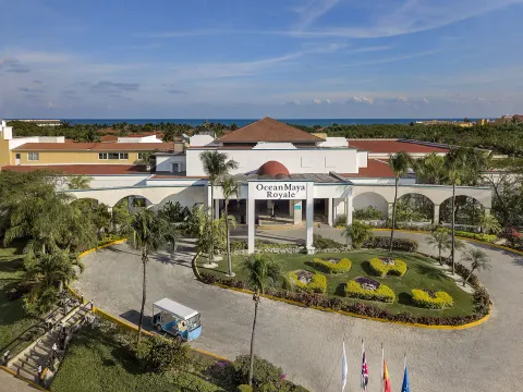 Aerial view of the entrance, gardens, and sea beyond at Ocean Maya Royale.