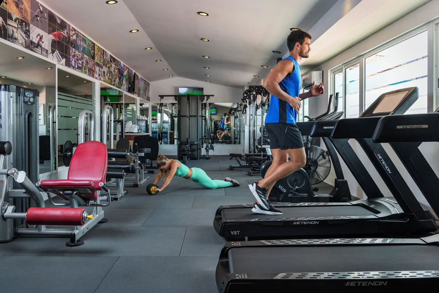 Fitness center with treadmills and weight machines at Ocean Maya Royale.