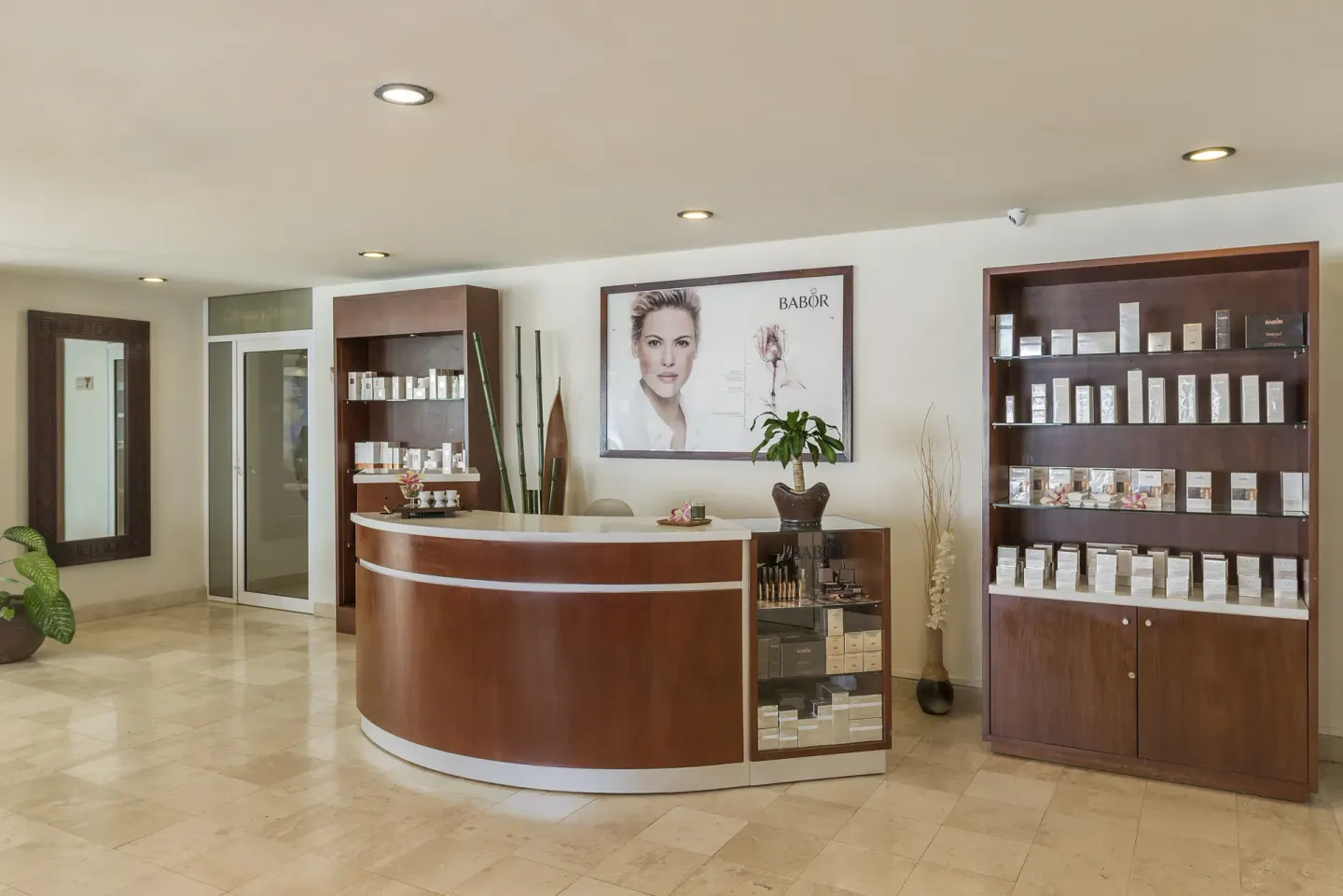 Spa reception desk with product displays at Ocean Maya Royale.