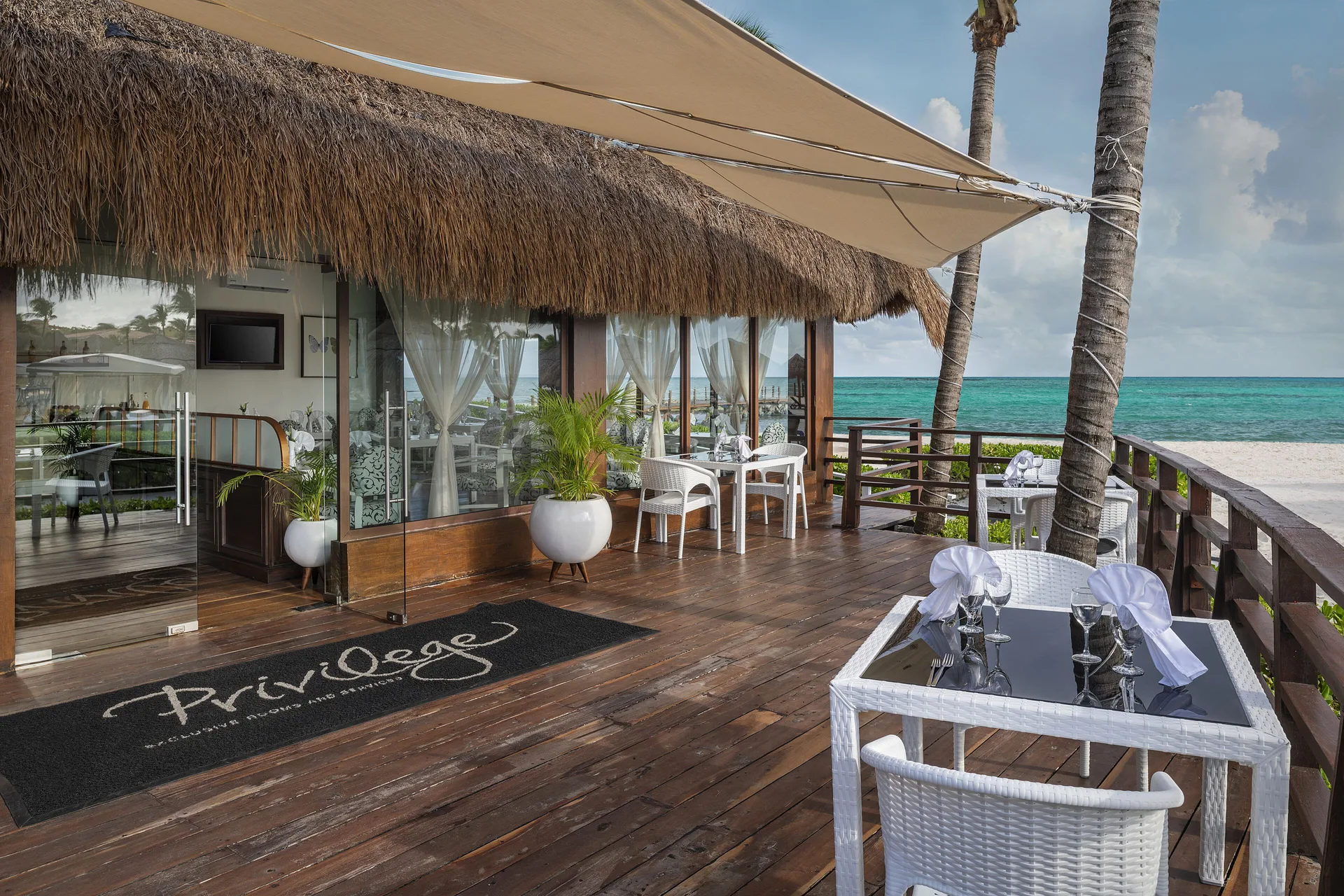 Beachfront terrace of Privilege Lounge Restaurant at Ocean Maya Royale.