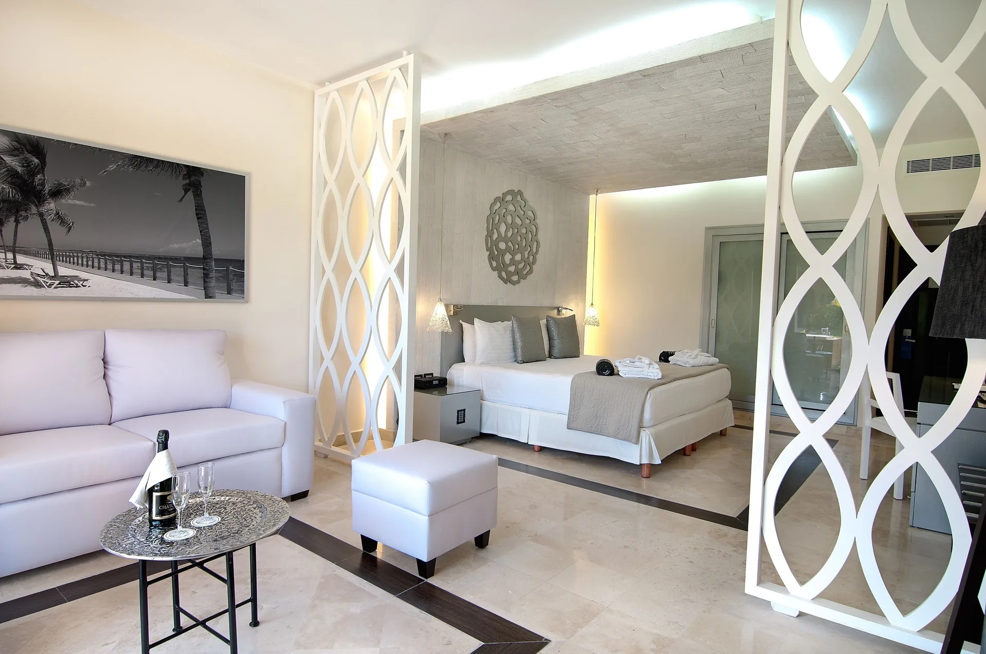 Privilege Junior Suite living area and bed at Ocean Maya Royale.