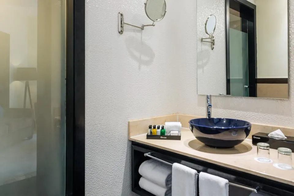 Junior suite bathroom vanity with vessel sink at Ocean Maya Royale.