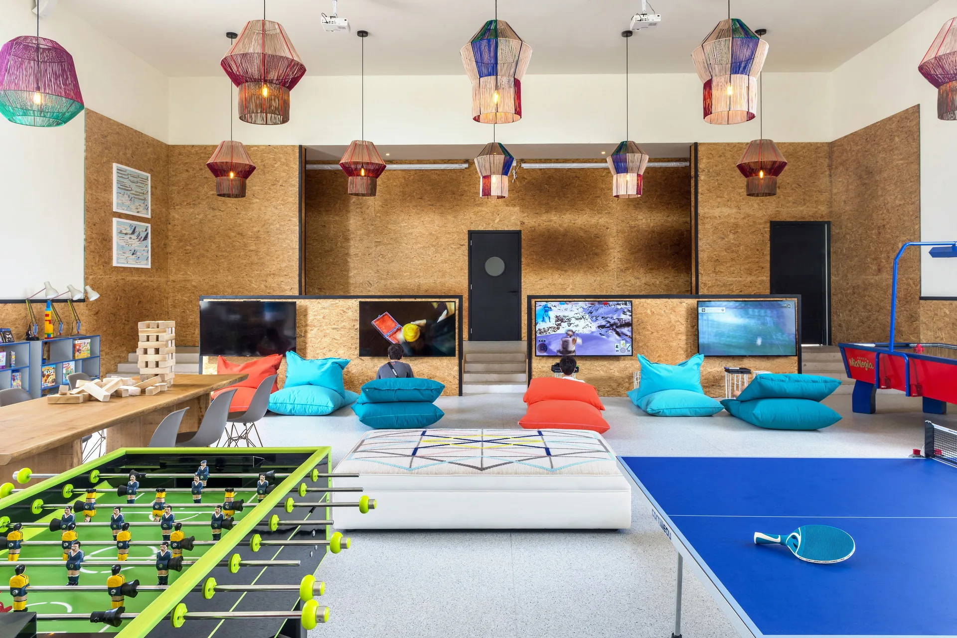 Game lounge with foosball, ping-pong and floor cushions at Ocean Riviera Paradise.