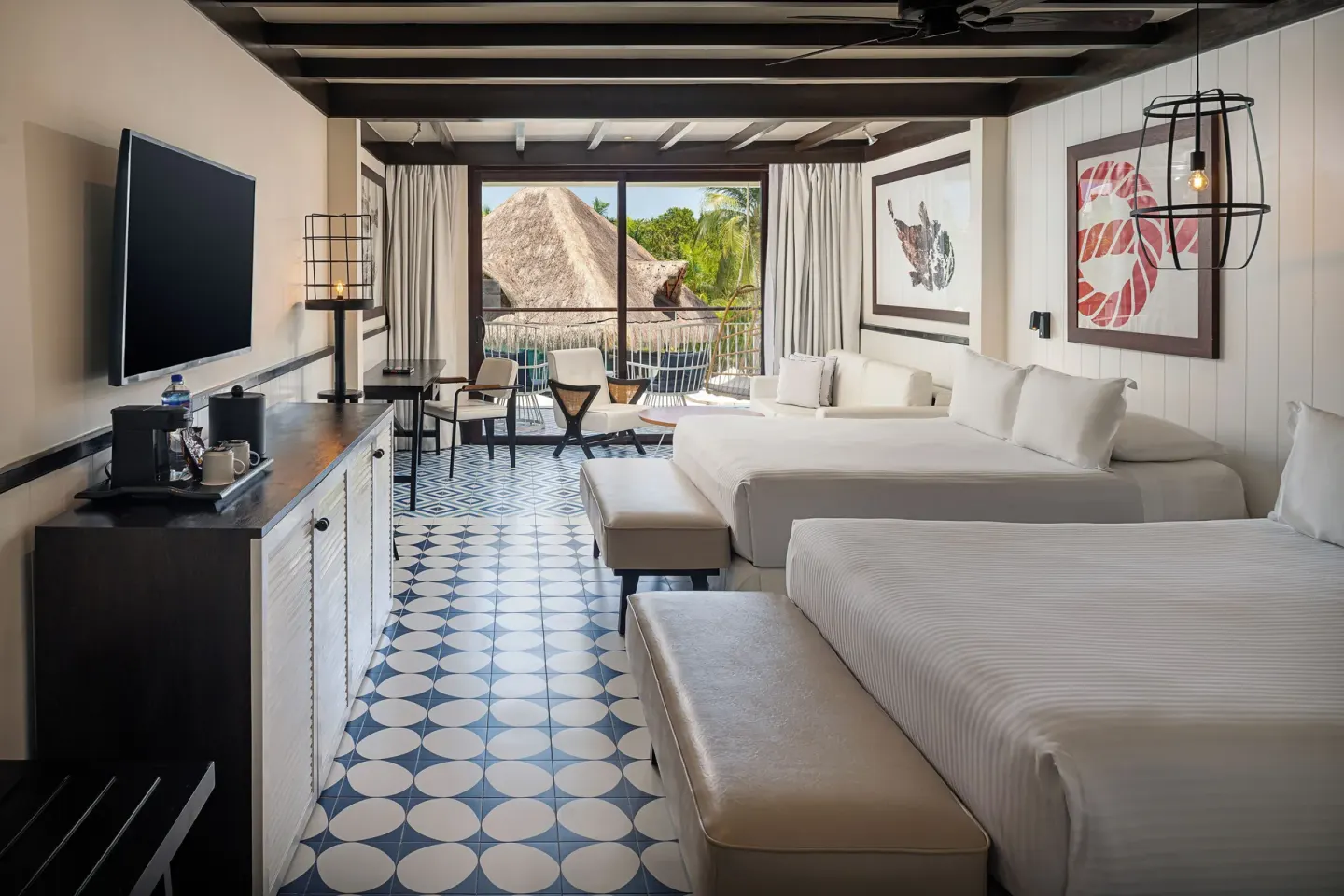 Two-bed guest room with balcony and patterned tile floor at Ocean Riviera Paradise.