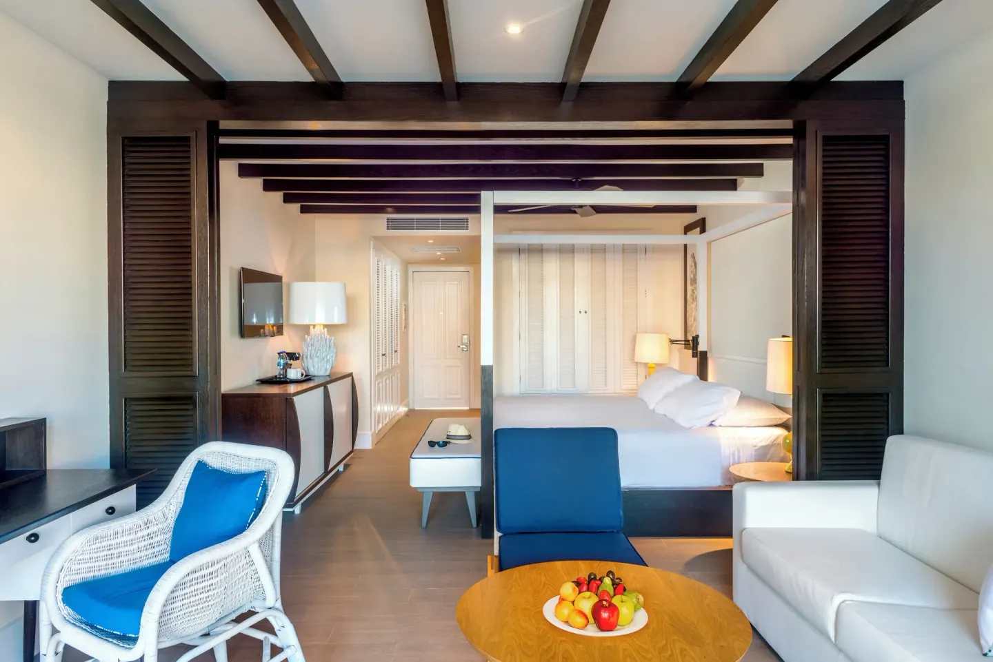 Guest room with king bed, sofa, desk, and seating area at Ocean Riviera Paradise.