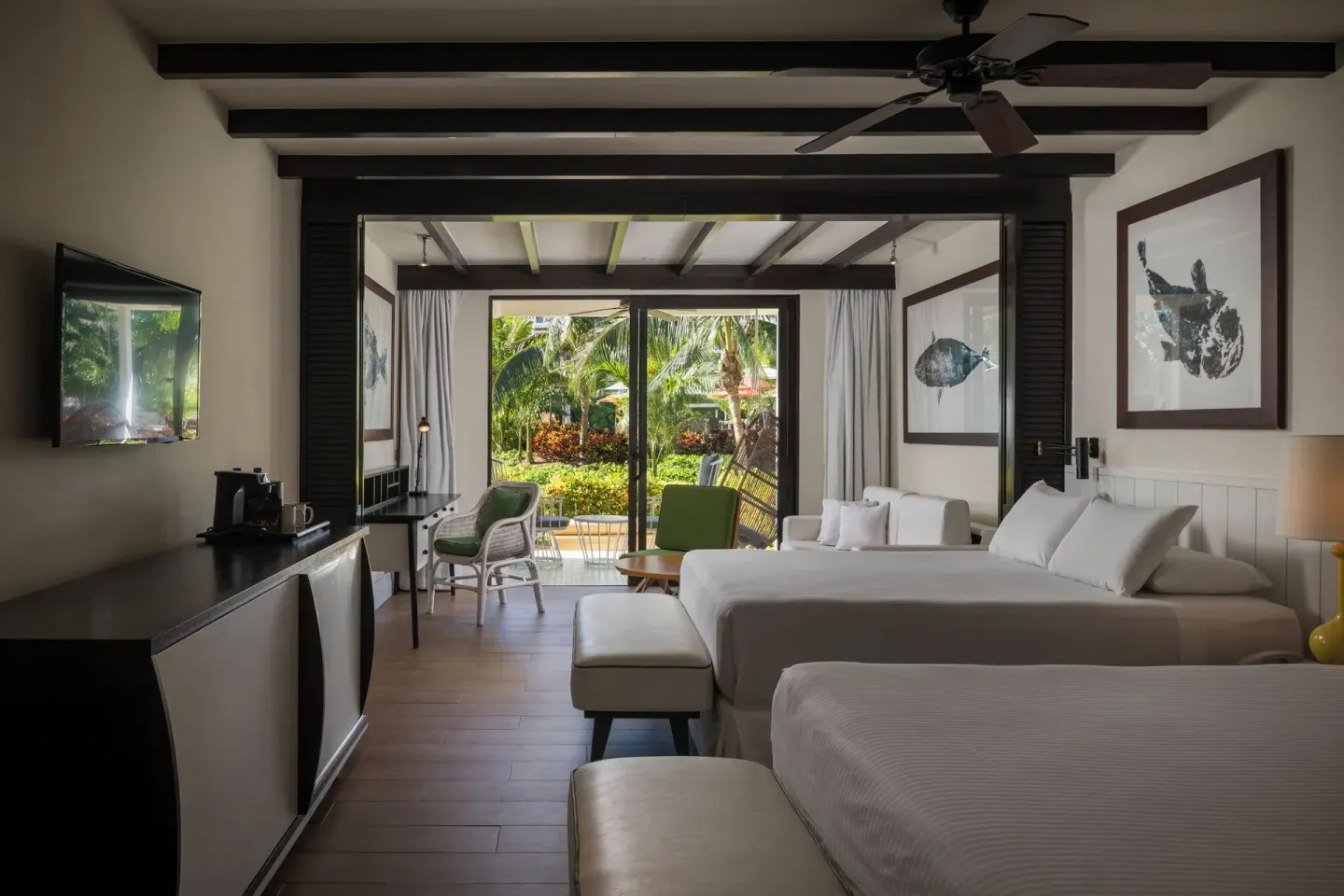 Two-bed guest room with garden-facing patio at Ocean Riviera Paradise.