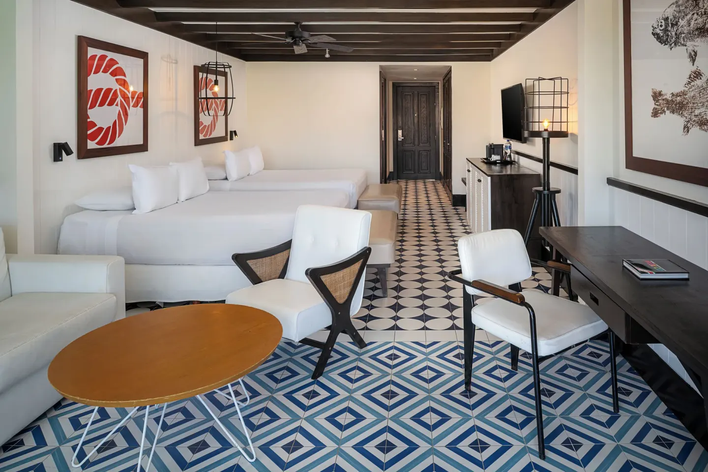 Two-bed guest room with sitting area at Ocean Riviera Paradise.