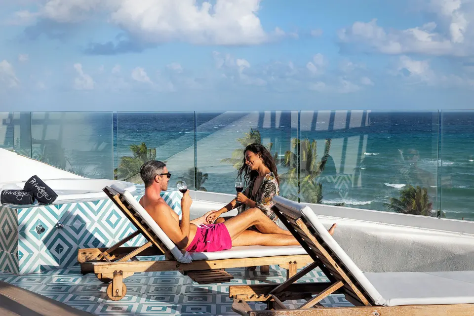 Guests relax on ocean-view loungers at Ocean Riviera Paradise.