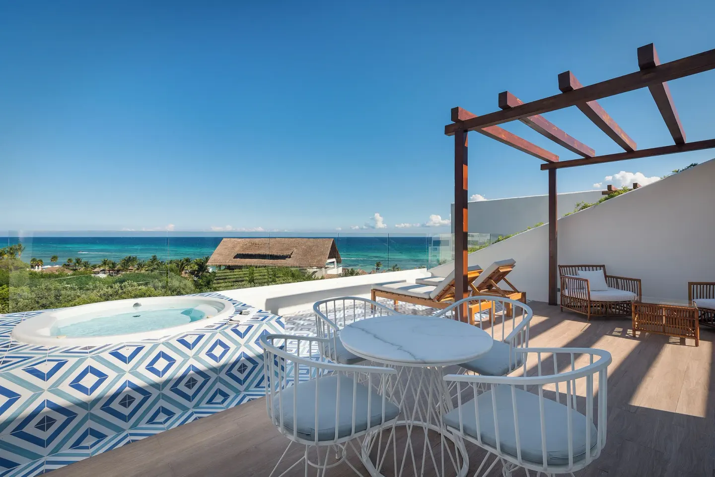 Ocean-view terrace with whirlpool tub at Ocean Riviera Paradise.