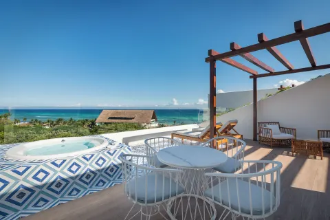 Ocean-view terrace with whirlpool tub at Ocean Riviera Paradise.