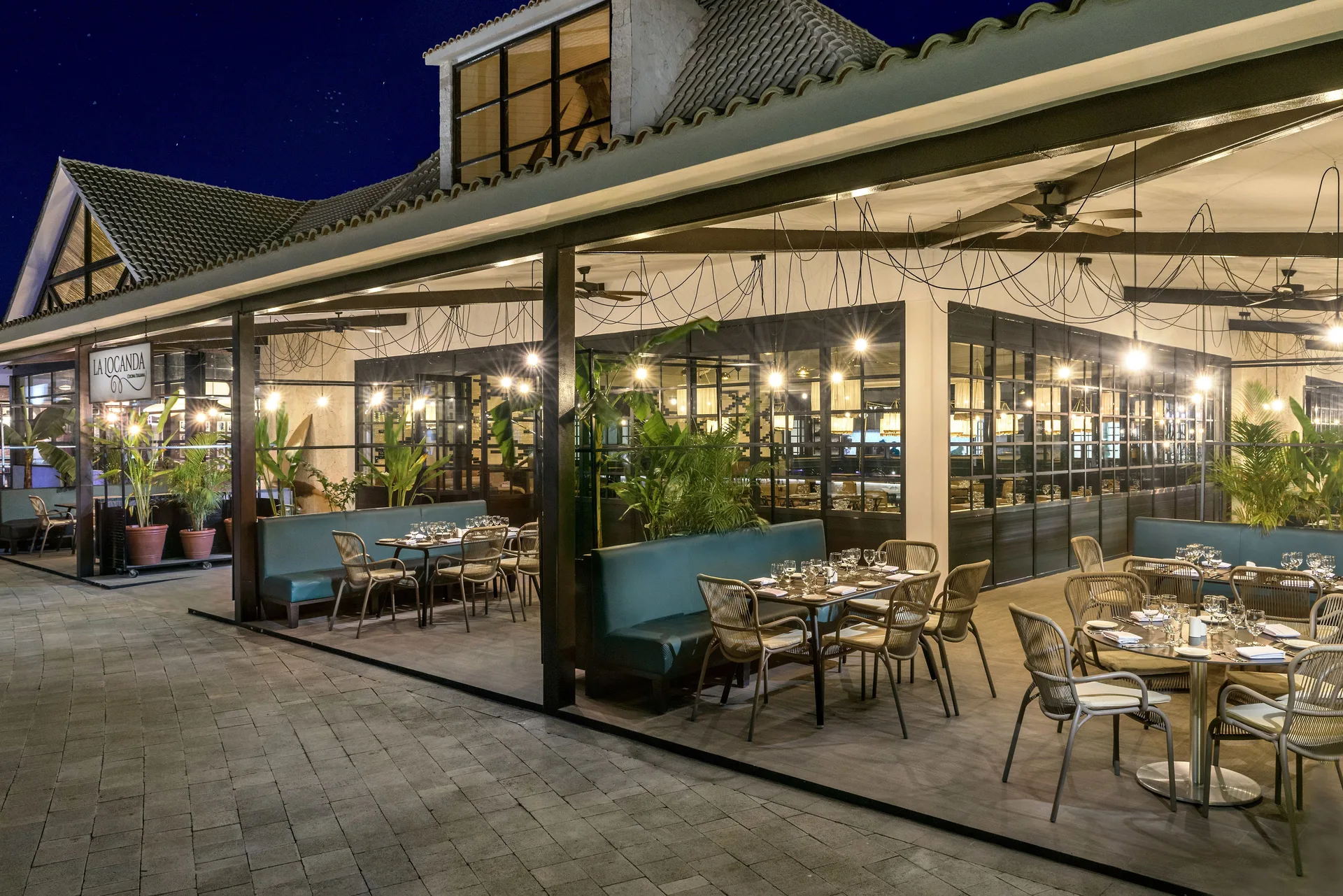 La Locanda patio dining area lit at night at Ocean Riviera Paradise.