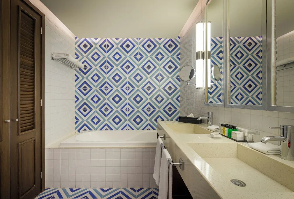 Junior Suite Eden bathroom with bathtub and double sinks at Ocean Riviera Paradise.