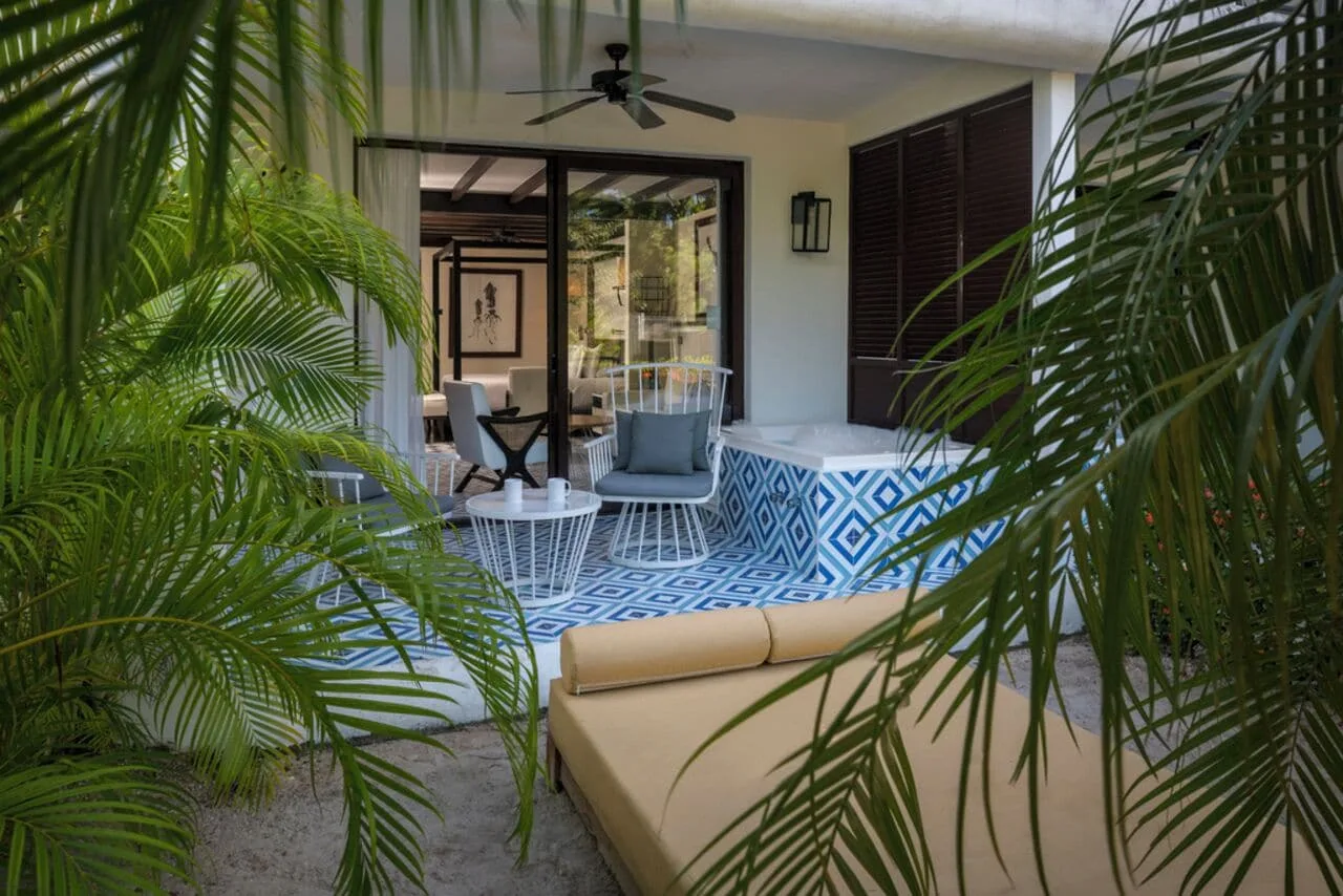 Junior Suite Eden terrace with Jacuzzi and loungers at Ocean Riviera Paradise.