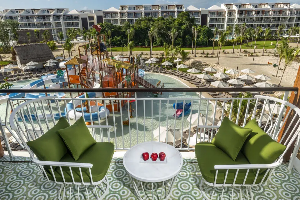 Junior Suite Waterpark Side balcony overlooking the waterpark at Ocean Riviera Paradise.