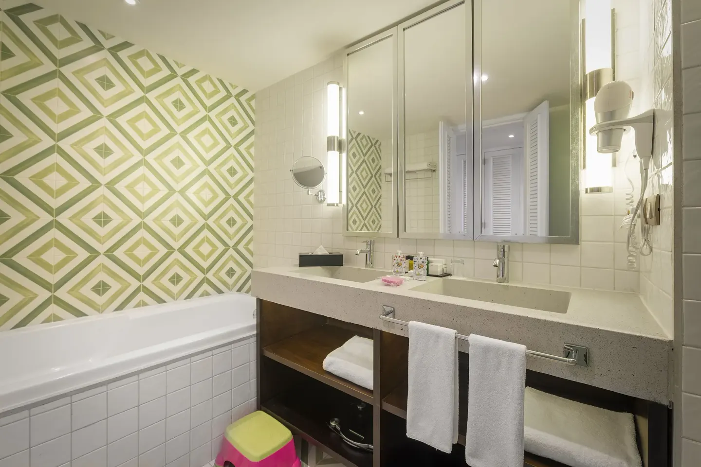 Junior Suite Waterpark Side bathroom with tub and double vanity at Ocean Riviera Paradise.