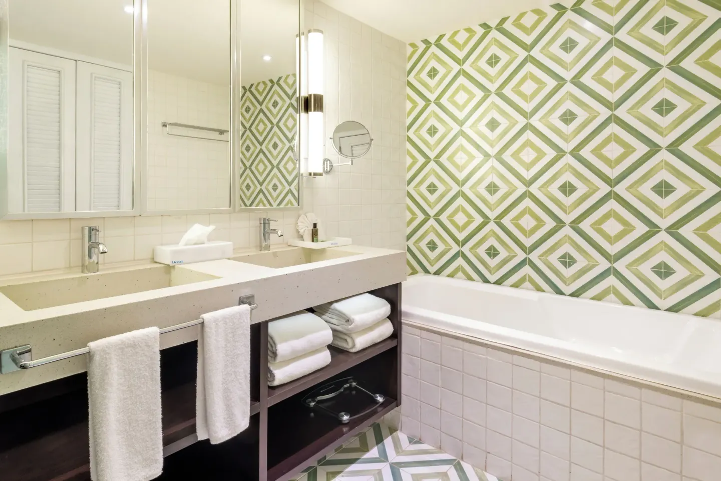 Junior Suite Waterpark Side bathroom vanity and bathtub at Ocean Riviera Paradise.