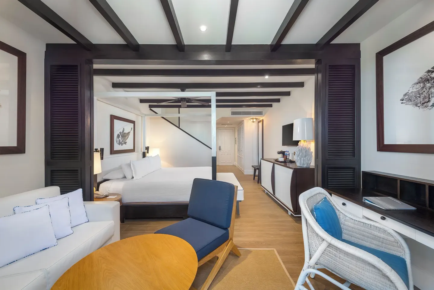 Paradise Junior Suite Rooftop sitting area and king bed at Ocean Riviera Paradise.