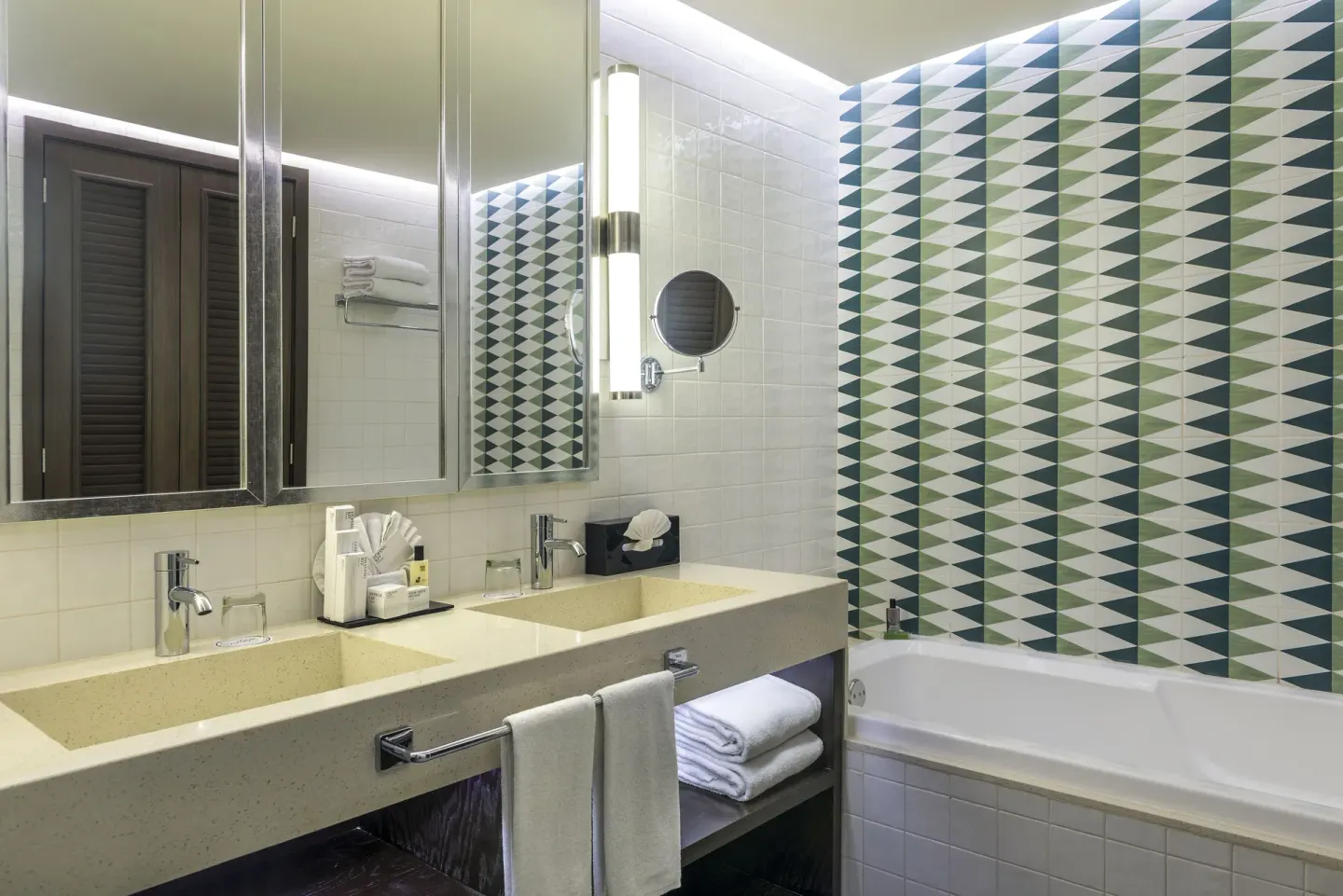 Privilege Junior Suite bathroom with double vanity and tub at Ocean Riviera Paradise.