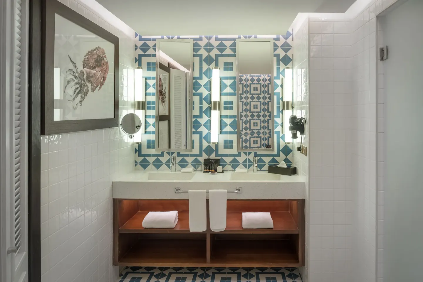 Privilege Junior Suite bathroom with double sinks and blue patterned tile at Ocean Riviera Paradise.