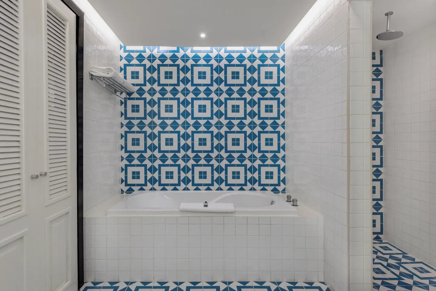 Bathroom with bathtub and walk-in shower in a suite at Ocean Riviera Paradise.