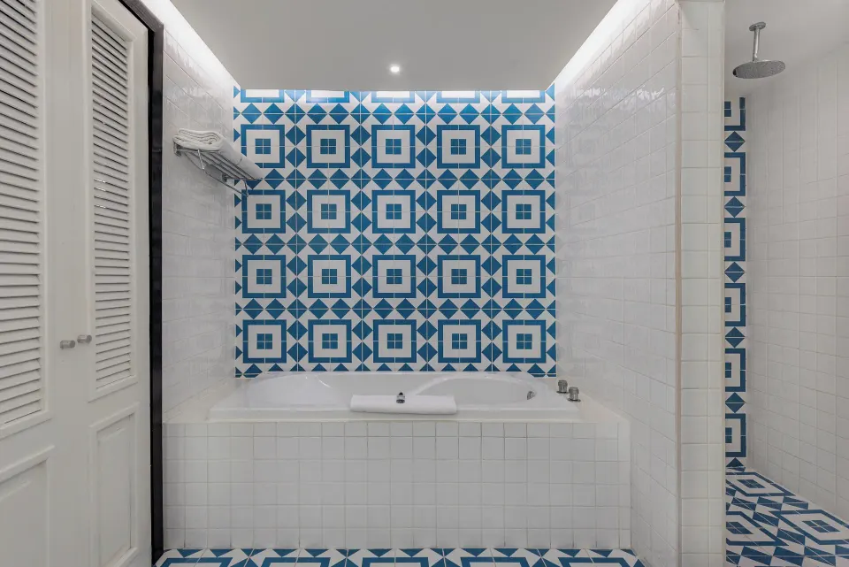Bathroom with bathtub and walk-in shower in a suite at Ocean Riviera Paradise.