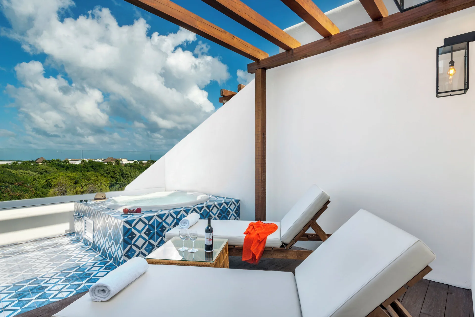 Roof Top Junior Suite Eden terrace with loungers and hot tub at Ocean Riviera Paradise.