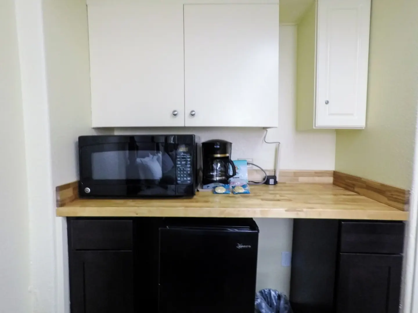 Kitchenette counter with microwave, coffee maker and mini fridge at Ohia Waikiki Studio Suites.