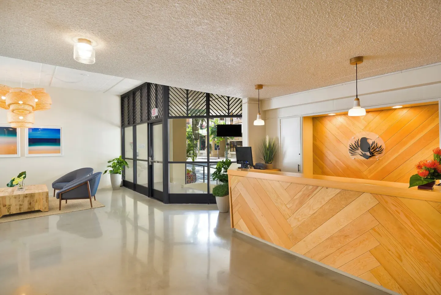 Reception desk and lobby entrance at Ohia Waikiki Studio Suites.