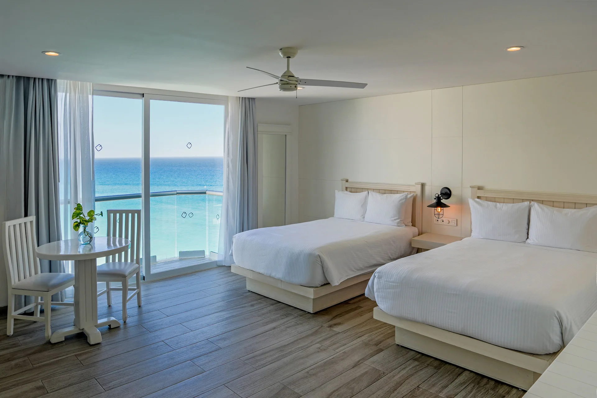 Inspira Superior Room Ocean View at Oleo Cancun Playa Resort with two beds, private balcony, and Caribbean Sea views in Cancun's Hotel Zone.