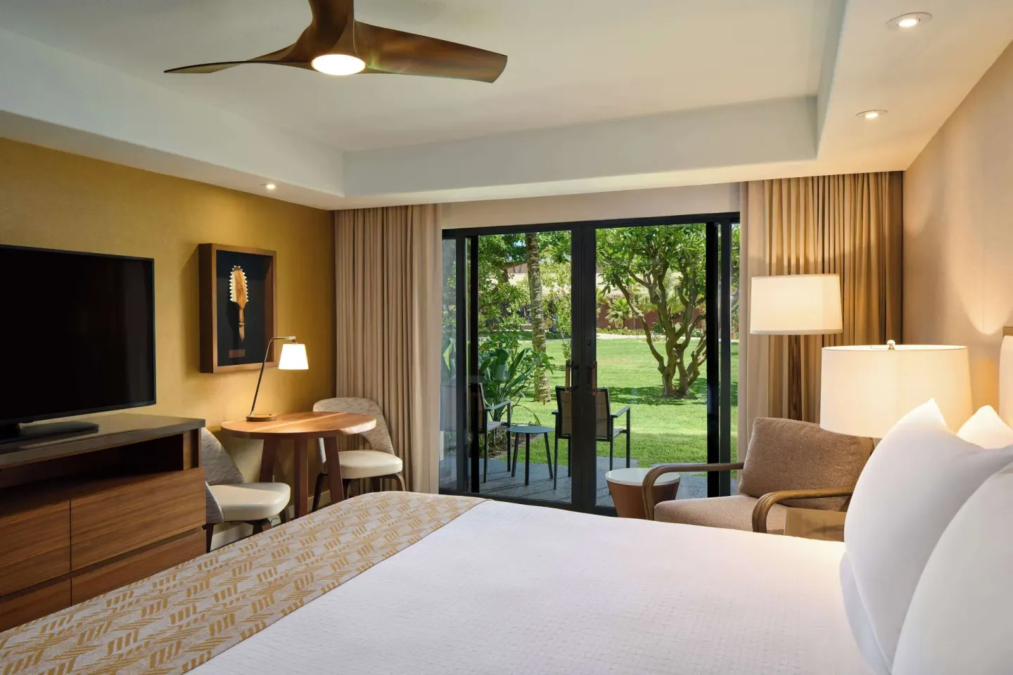 King guest room with patio and garden view at Outrigger Kaanapali Beach Resort.