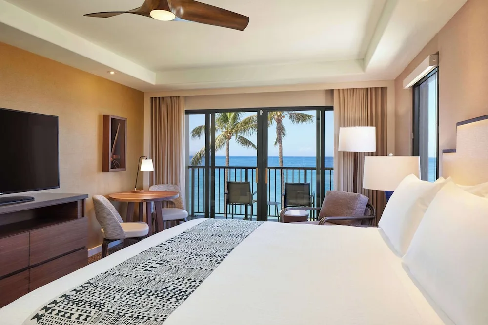 King guest room with balcony facing the ocean at Outrigger Kaanapali Beach Resort.
