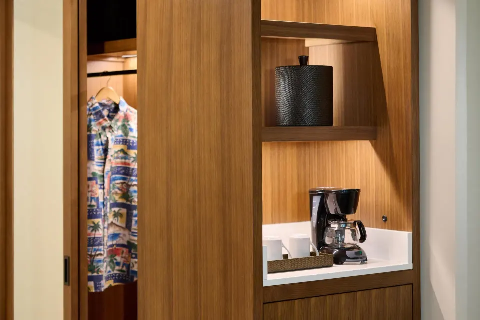 Coffee station and closet in a Premium Room Partial Ocean View at Outrigger Kaanapali Beach Resort.