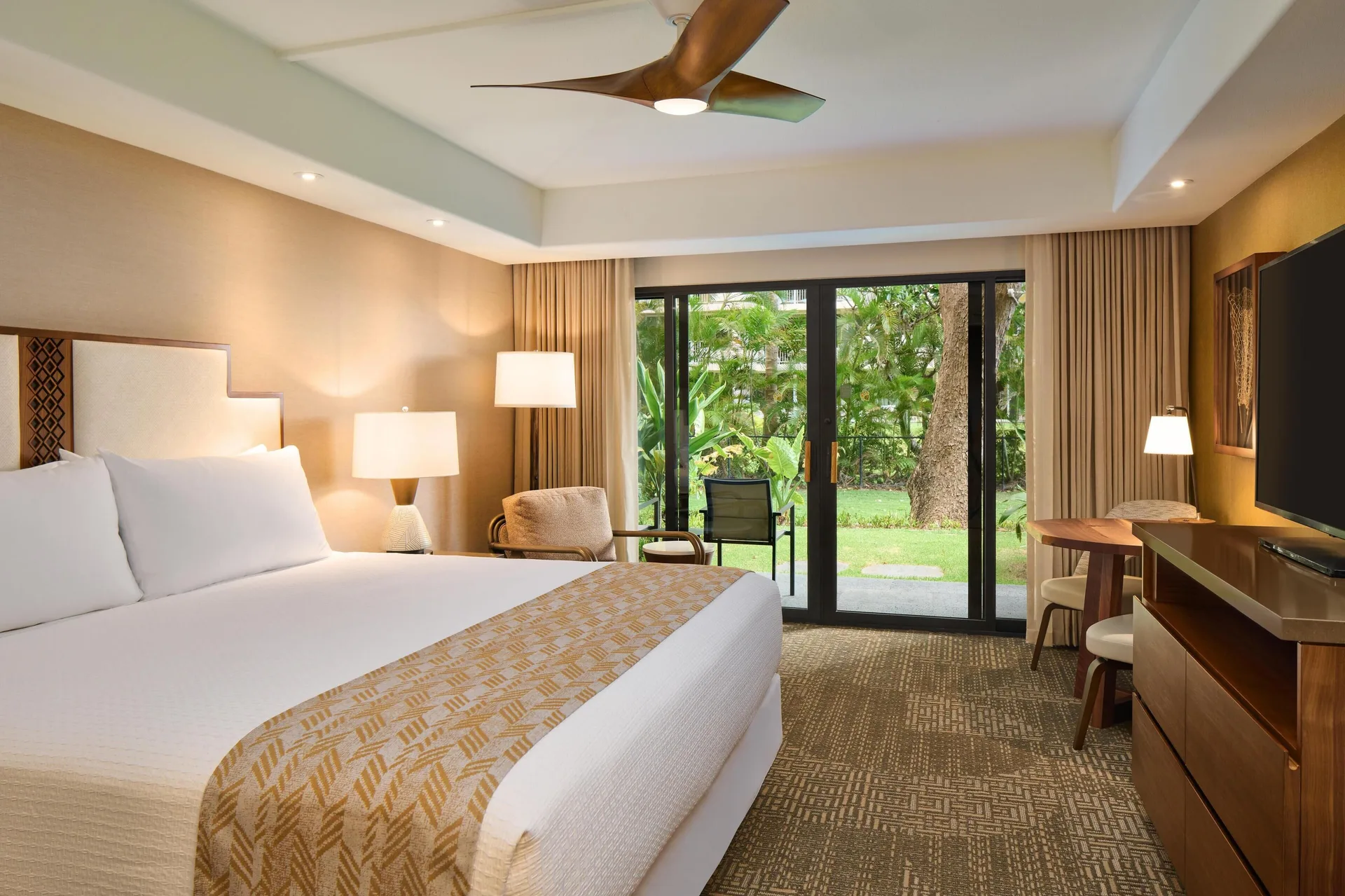 Premium Resort View king room with garden patio at Outrigger Kaanapali Beach Resort.